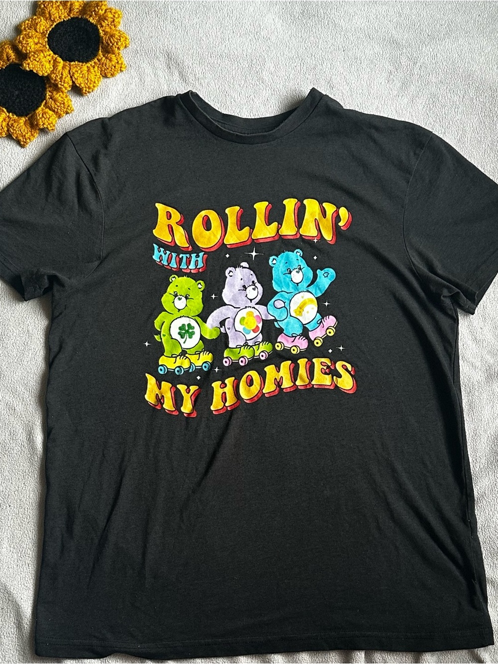 Care Bears Black Graphic Tee with Yellow, Green, Purple & Blue Art